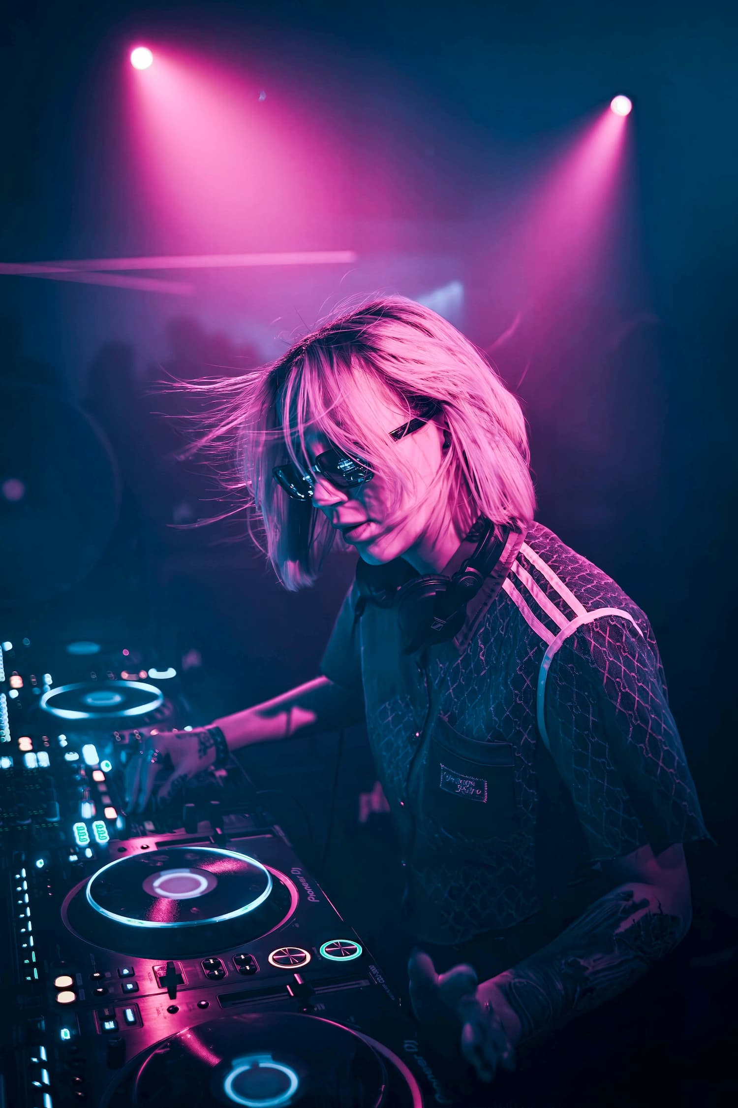 Femal DJ wearing sunglasses at a concert